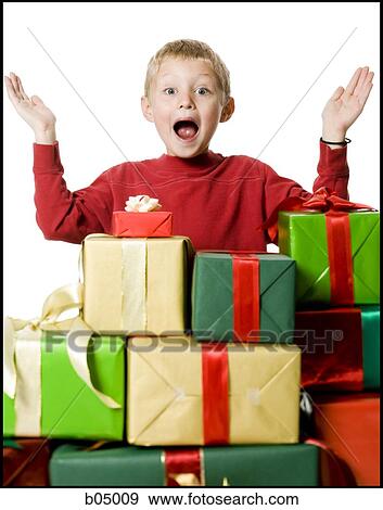 Stock Photo - Boy with Christmas gifts. Fotosearch