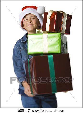 Stock Photo - Boy with Christmas gifts. Fotosearch