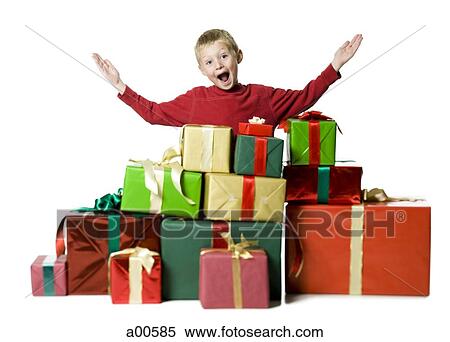 Stock Photography - Boy with Christmas gifts. Fotosearch