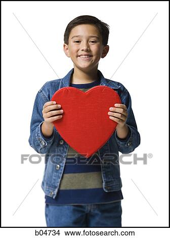 Picture - Boy with red heart. Fotosearch