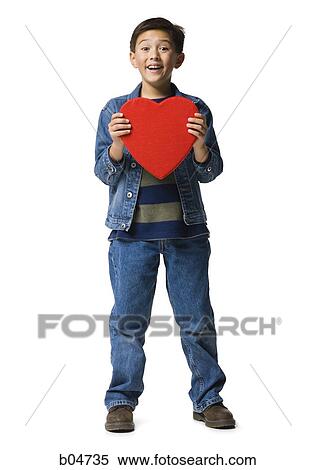 Boy with red heart View Large Photo Image Stock Photography - Boy with red heart. Fotosearch