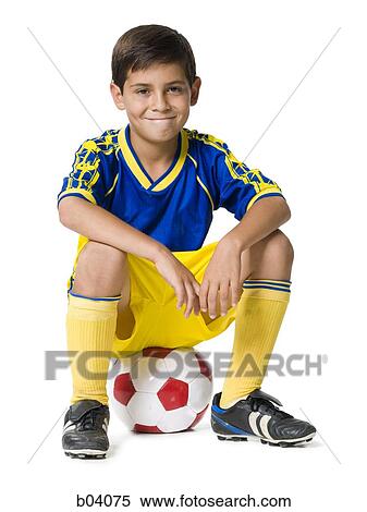 Stock Photography - Boy with soccer ball. Fotosearch