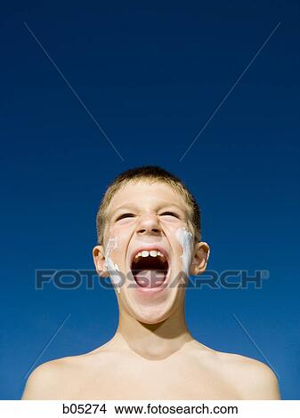 Boy with suntan lotion shouting View Large Photo Image Picture - Boy with suntan lotion shouting. Fotosearch