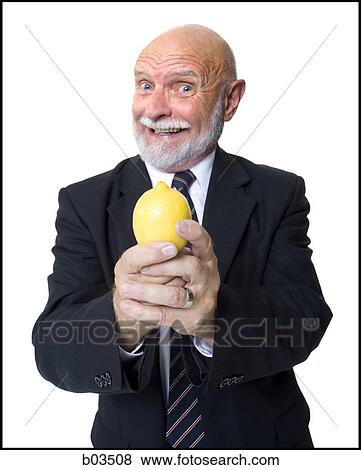 Business man holding lemon View Large Photo Image Stock Photo - Business man holding lemon. Fotosearch