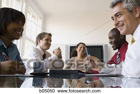 Business meeting with five people View Large Photo Image Stock Image - Business meeting with five people. Fotosearch