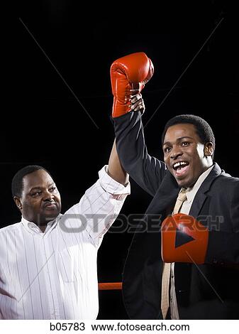 Stock Image - Businessman boxing. Fotosearch