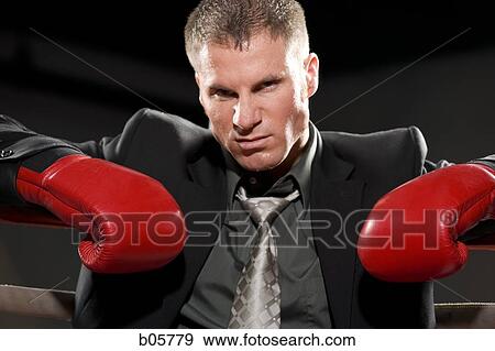 Stock Photo - Businessman boxing. Fotosearch