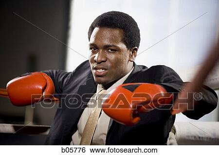 Stock Photograph - Businessman boxing. Fotosearch