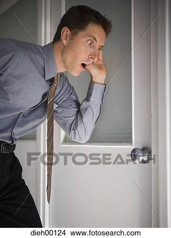 Picture - Businessman eavesdropping. Fotosearch