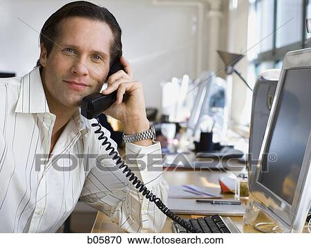 Businessman on the phone View Large Photo Image Stock Image - Businessman on the phone. Fotosearch