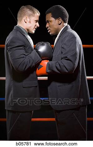 Stock Image - Businessmen boxing. Fotosearch