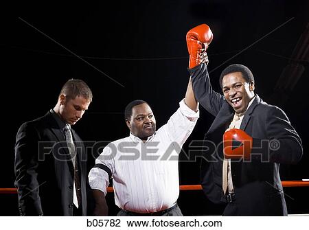 Stock Image - Businessmen boxing. Fotosearch