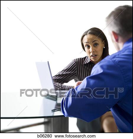 Stock Image - Businesspeople working. Fotosearch