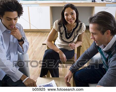 Stock Photography - Businesspeople working. Fotosearch