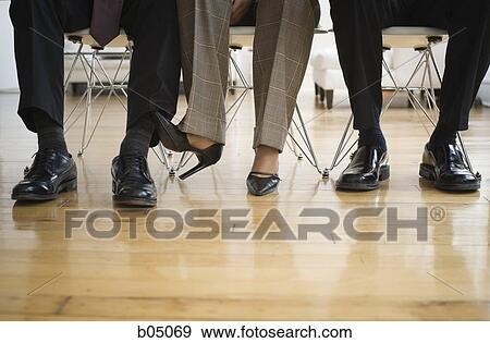 Businesswoman Caressing Businessman S Leg Under Table Stock Photo Stock Photo Businesswoman Caressing Businessman S Leg Under Table Fotosearch