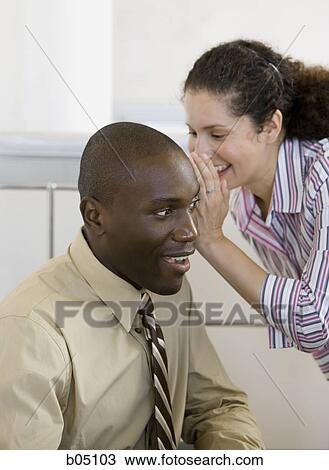 Businesswoman whispering to businessman View Large Photo Image Stock Image - Businesswoman whispering to businessman. Fotosearch