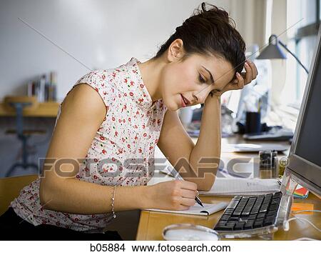Picture - Businesswoman working. Fotosearch