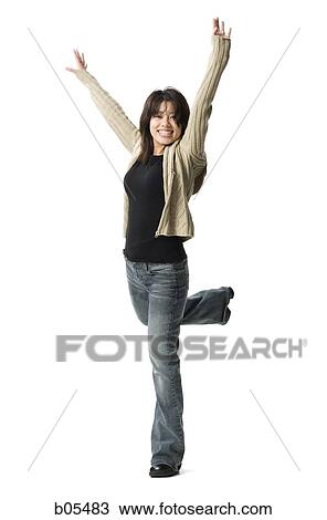 Casually dressed woman leaping View Large Photo Image Stock Image - Casually dressed woman leaping. Fotosearch