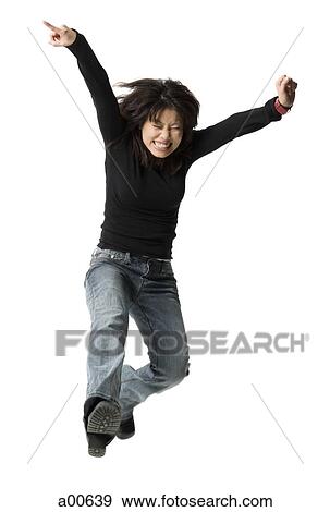 Casually dressed woman leaping View Large Photo Image Stock Photo - Casually dressed woman leaping. Fotosearch