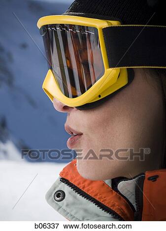 Stock Photo - Close-up of a woman wearing ski goggles. Fotosearch