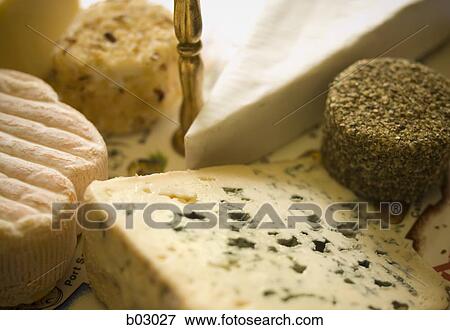Stock Photo - Close up of cheeses. Fotosearch