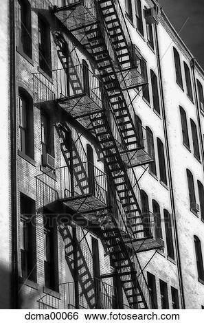 Stock Photograph - Close up of fire escapes on building. Fotosearch