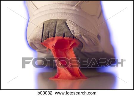 Stock Image - Close up of gum stuck to running shoe. Fotosearch