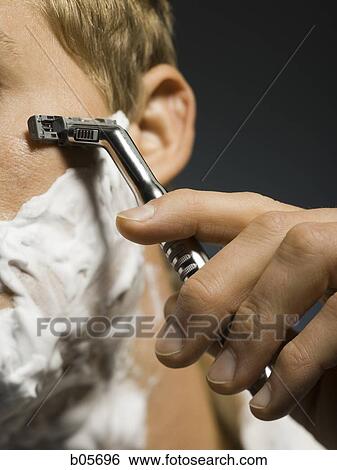 Close up of man shaving View Large Photo Image Stock Photograph - Close up of man shaving. Fotosearch