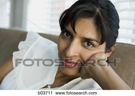 Close up of woman on sofa View Large Photo Image Stock Image - Close up of woman on sofa. Fotosearch