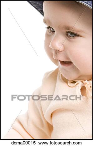 Stock Photography - Closeup of a baby with hat. Fotosearch