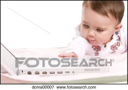 Closeup of a baby with laptop View Large Photo Image Stock Photo - Closeup of a baby with laptop. Fotosearch