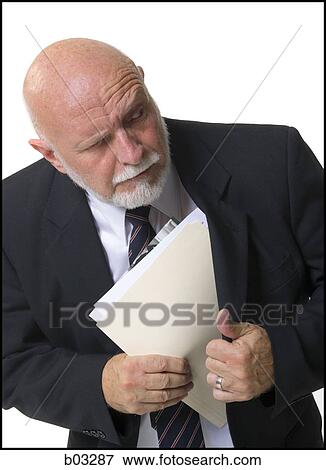 Stock Photo - Closeup of a businessman with documents. Fotosearch