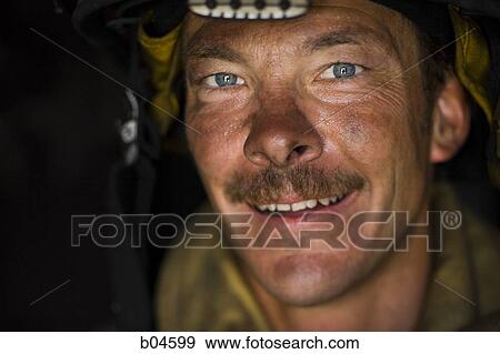 Stock Photo - Closeup of a firefighter smiling. Fotosearch