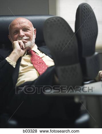 Closeup of businessman in office View Large Photo Image Stock Photo - Closeup of businessman in office. Fotosearch