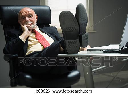 Closeup of businessman in office View Large Photo Image Stock Photograph - Closeup of businessman in office. Fotosearch