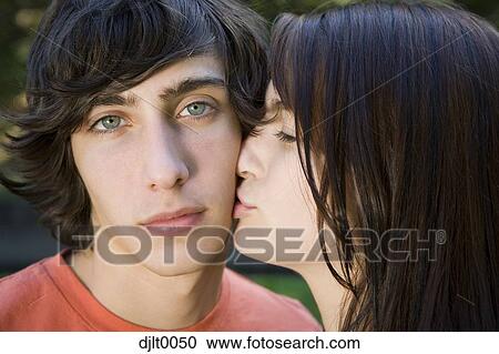 Stock Image - Closeup of couple kissing. Fotosearch