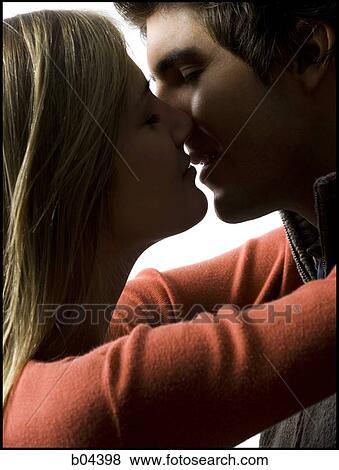 Stock Photo - Closeup of couple kissing. Fotosearch