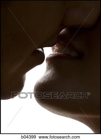 Stock Photo - Closeup of couple kissing. Fotosearch