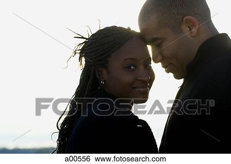 Stock Photograph - Closeup of couple smiling. Fotosearch