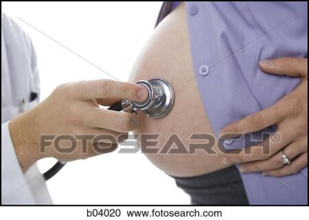 Closeup of doctor checking pregnant belly with stethoscope View Large Photo Image Stock Image - Closeup of doctor checking pregnant belly with stethoscope. Fotosearch