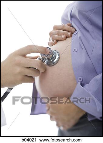 Closeup of doctor checking pregnant belly with stethoscope View Large Photo Image Stock Image - Closeup of doctor checking pregnant belly with stethoscope. Fotosearch