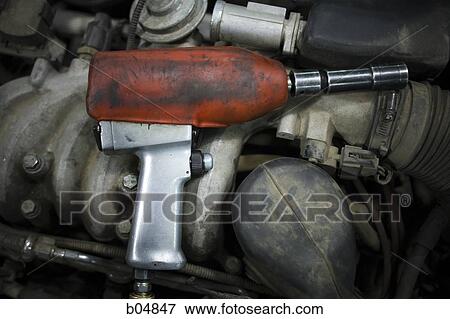 Closeup of drill under hood of car View Large Photo Image Stock Photo - Closeup of drill under hood of car. Fotosearch