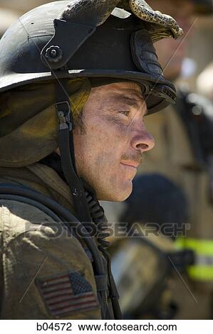 Closeup of fire fighter at work View Large Photo Image Stock Image - Closeup of fire fighter at work. Fotosearch