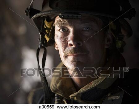 Stock Photo - Closeup of fire fighter at work. Fotosearch