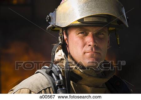 Closeup of fire fighter at work View Large Photo Image Stock Photo - Closeup of fire fighter at work. Fotosearch