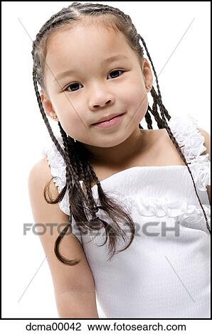 Stock Image - Closeup of girl with braids. Fotosearch