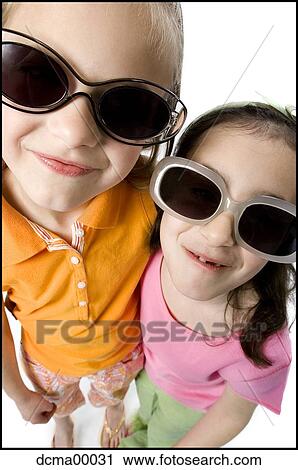 Stock Image - Closeup of girls with sunglasses. Fotosearch