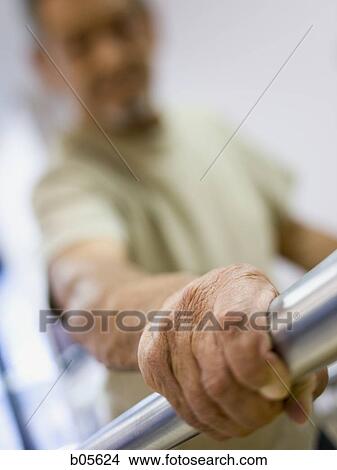 Closeup of male hand on physical therapy bars View Large Photo Image Picture - Closeup of male hand on physical therapy bars. Fotosearch
