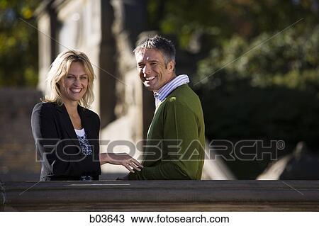 Stock Image - Closeup of man and woman smiling. Fotosearch