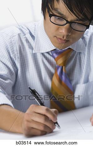 Closeup of man preparing for presentation View Large Photo Image Picture - Closeup of man preparing for presentation. Fotosearch